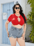 Plus size woman wearing a cropped twisted front short sleeve blouse